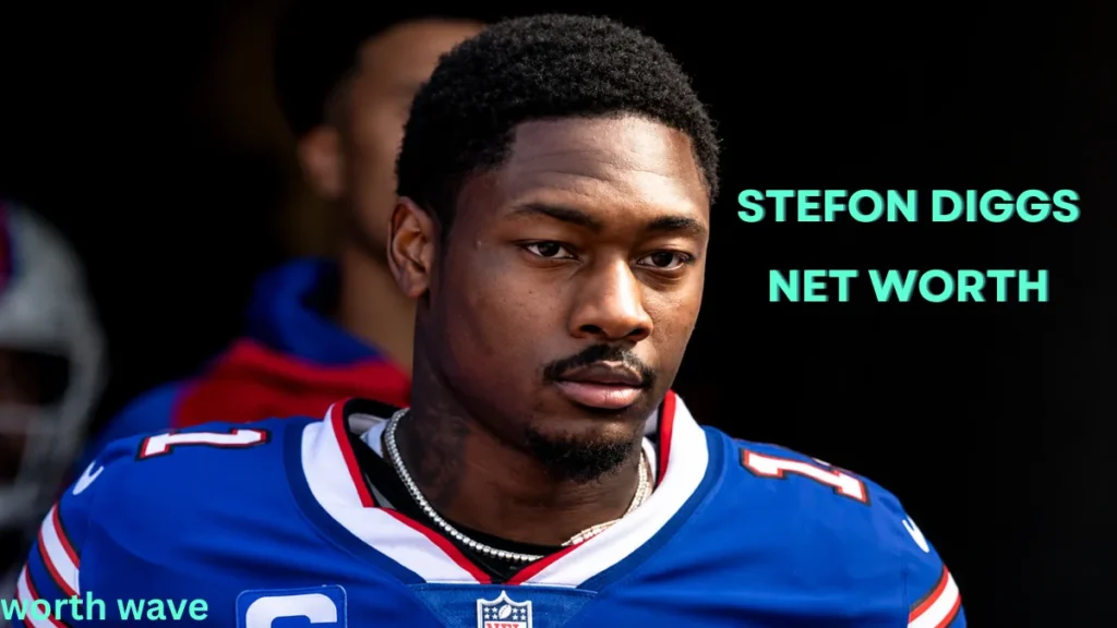 Stefon Diggs in his NFL uniform during a game, featured in an article about Stefon Diggs Net Worth and career earnings.
