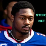 Stefon Diggs in his NFL uniform during a game, featured in an article about Stefon Diggs Net Worth and career earnings.