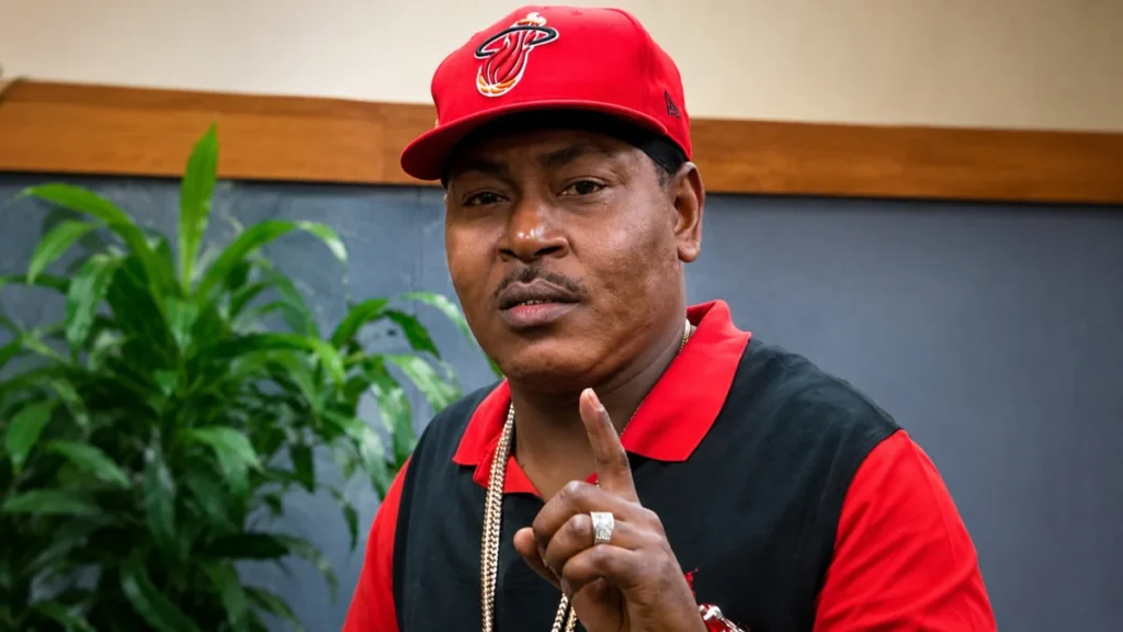 Trick Daddy at a public appearance wearing a red cap and black shirt for the Trick Daddy Net Worth