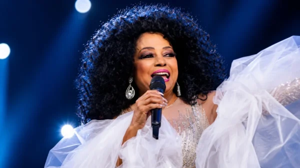 Diana Ross performing live on stage during a concert, featured in an article about Diana Ross Net Worth and her legendary music career.