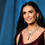 Demi Moore posing at a red carpet event for an article about Demi Moore Net Worth, her Hollywood career, wealth, and luxury lifestyle.