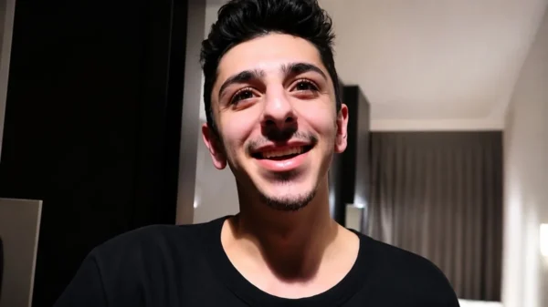 Faze Rug smiling in a close-up portrait for an article about Faze Rug Net Worth, YouTube career, earnings, and financial success.