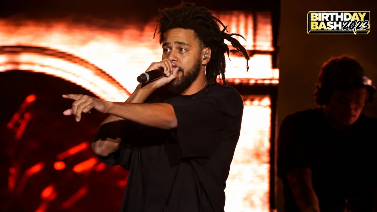 J Cole performing live during a concert, reflecting his personal lifestyle, successful music career, and J Cole Net Worth.
