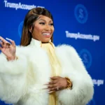 Nicki Minaj at a formal event in a white fur coat for Nicki Minaj Net Worth article