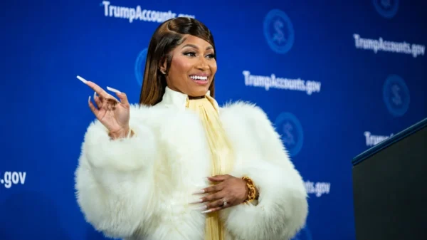 Nicki Minaj at a formal event in a white fur coat for Nicki Minaj Net Worth article