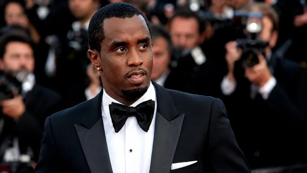 P Diddy Net Worth celebrity in black tuxedo at a red carpet event