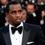 P Diddy Net Worth celebrity in black tuxedo at a red carpet event