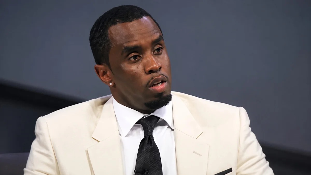 P Diddy Net Worth career and success in a formal white suit
