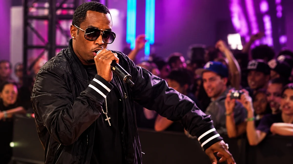 P Diddy Net Worth performer singing on stage in front of a crowd